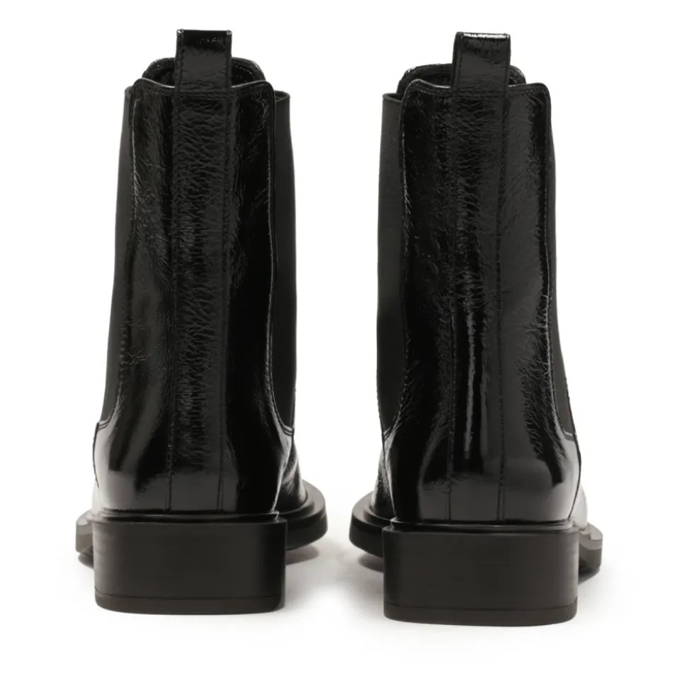 Chaussons noirs à effet froissé.Ce produit taille grand.